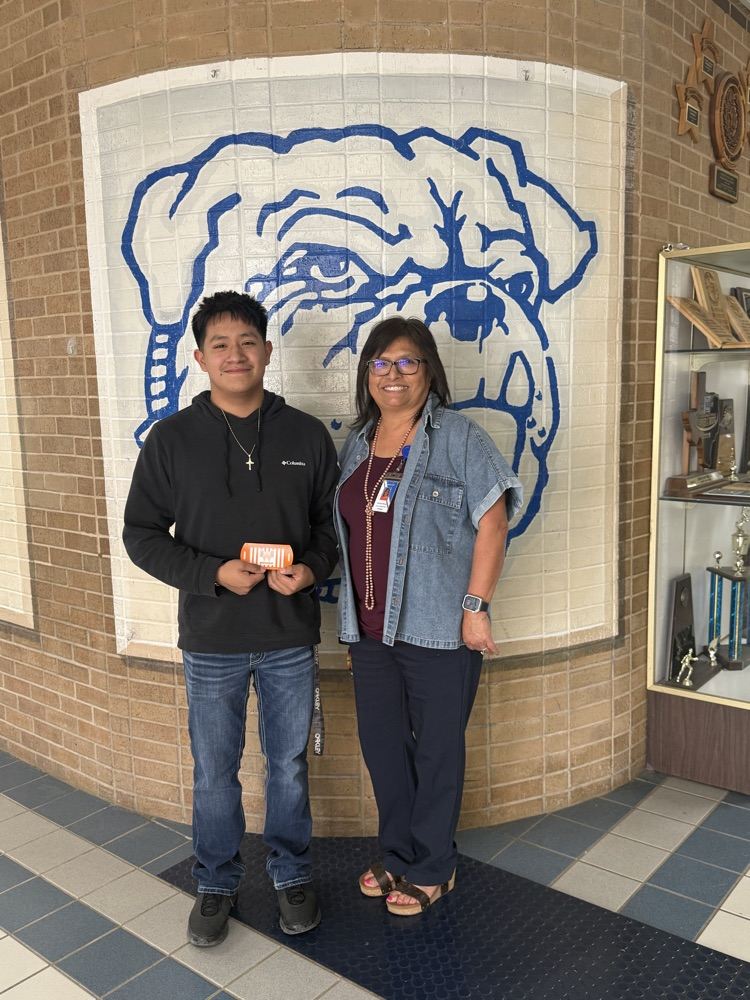 Mrs. Revels recognize Coach Warfield and Roberto Hildago for perfect attendance in January.