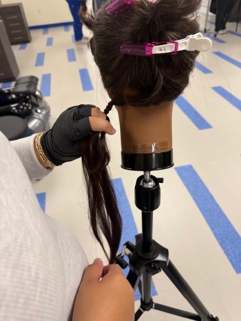 On Monday, Shambrica Creag returned, and the Cosmetology students showcased the braiding techniques she taught them last week.
