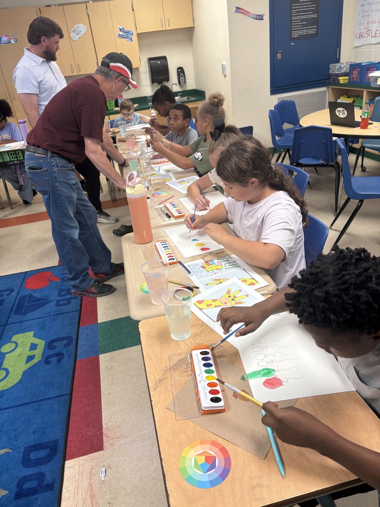 Art day success at Crockett Elementary! 🎨✨ Mr. & Mrs. Fleming joined Mrs. Elmore’s class for a watercolor workshop where students explored primary and secondary colors and created colorful balloons, a giraffe, and a fish. Proud of these young artists!