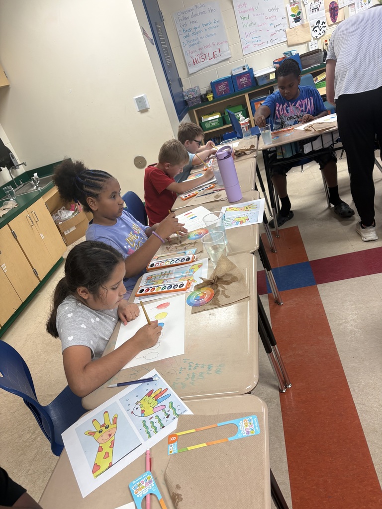 Art day success at Crockett Elementary! 🎨✨ Mr. & Mrs. Fleming joined Mrs. Elmore’s class for a watercolor workshop where students explored primary and secondary colors and created colorful balloons, a giraffe, and a fish. Proud of these young artists!