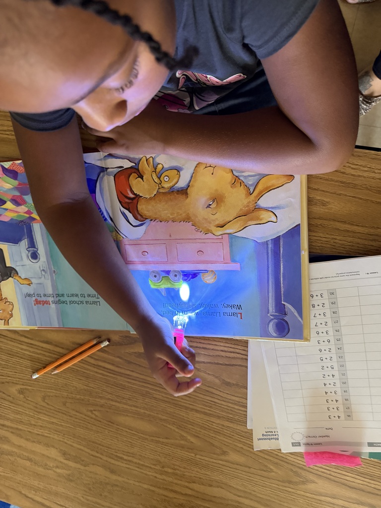📚💙 NATIONAL READING DAY FUN AT CROCKETT ELEMENTARY! 💙📚  Yesterday was National Reading Day, and our Bulldogs celebrated by diving into their favorite stories and discovering new ones. We wrapped up the day with a campus‑wide dark‑out flashlight reading — the perfect cozy ending to a day full of imagination and adventure.