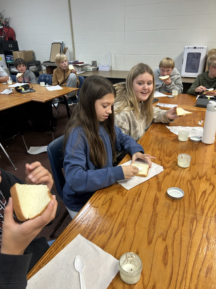 Students trying homemade butter