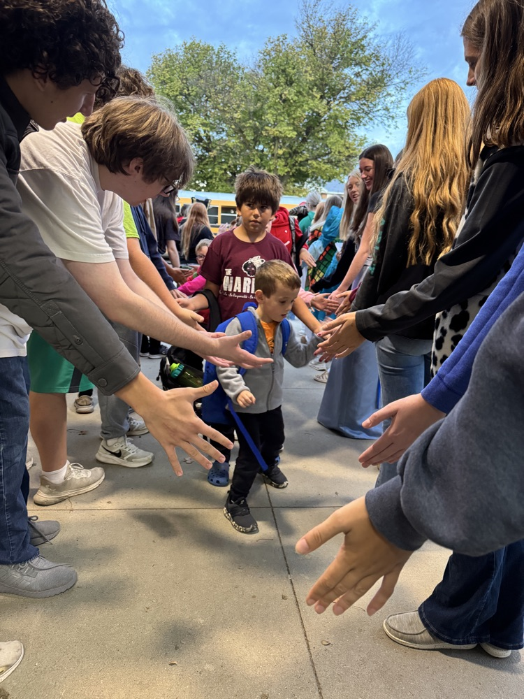 One-Act students giving high fives