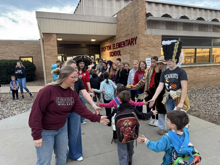 One-Act students giving high fives to elementary students