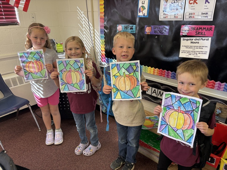 first grade with pumpkin paintings