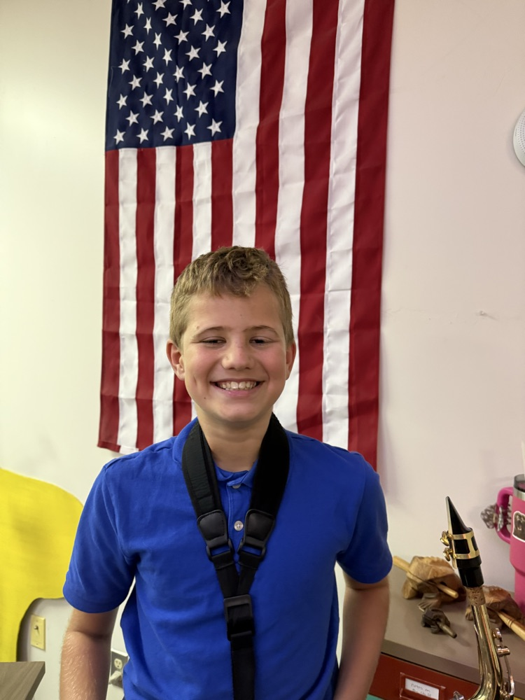 student passed the banner and made pep band