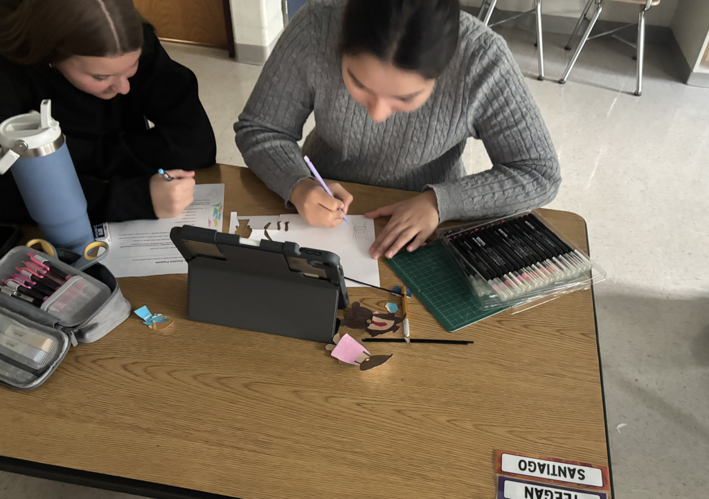 Ella and Teegan working on their puppets