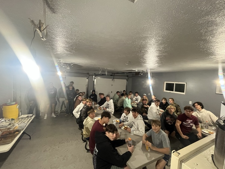 The football team eating a meal together