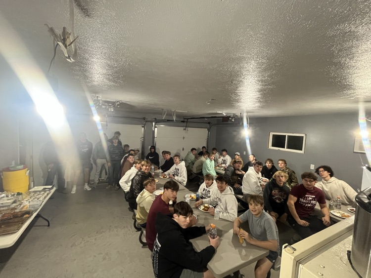 The football team eating a meal together