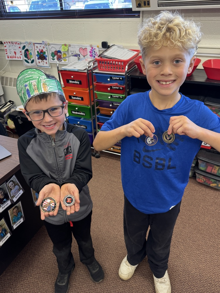 Tyler’s sons showing his medals of honor 