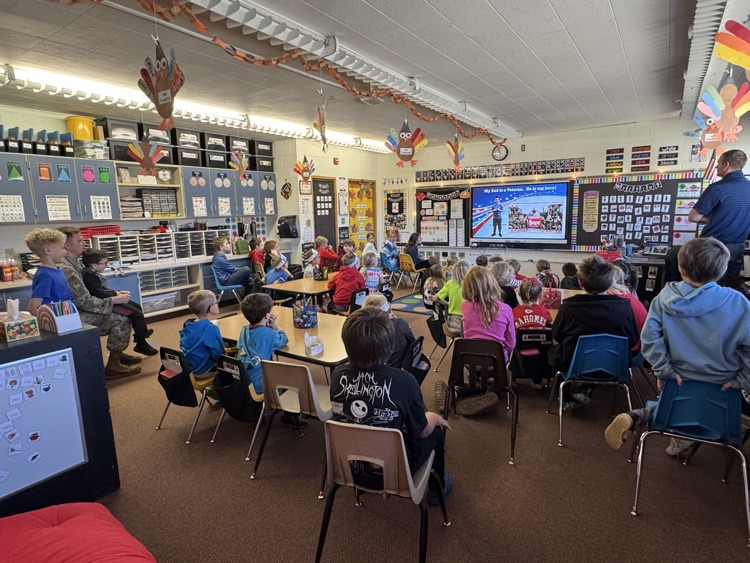 The group watching the Veteran’s Day green screen video