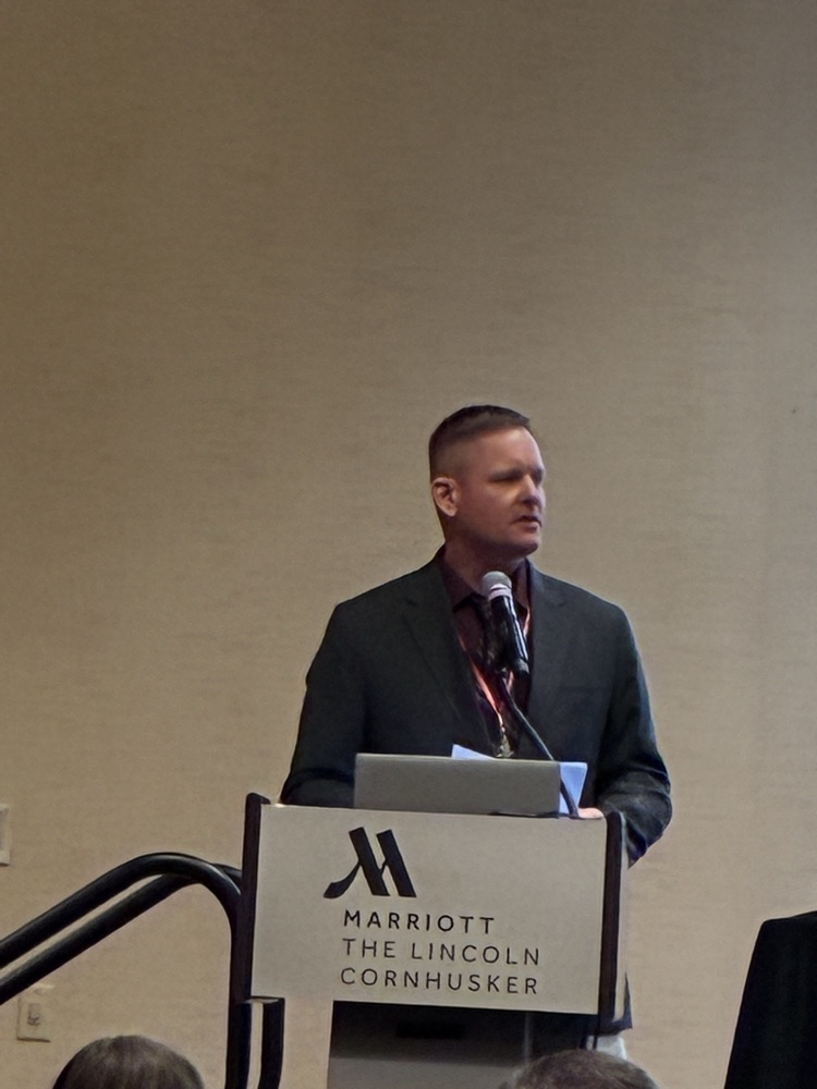 Mr. Ostermeyer accepting award