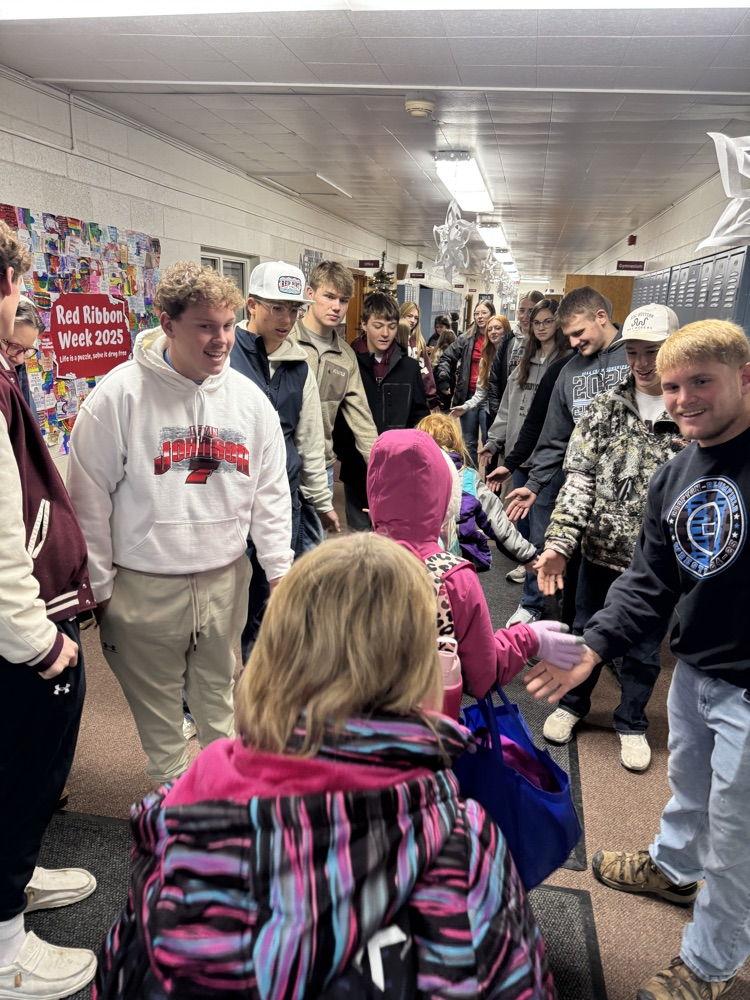 Wrestling team giving high fives