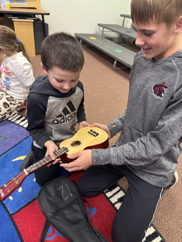 6th graders and Kindergarten students