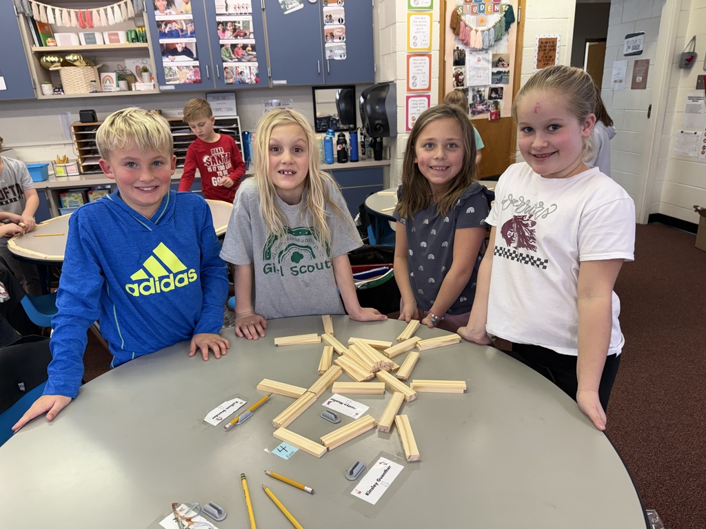 Second grade builds snowflakes with KEVA planks.