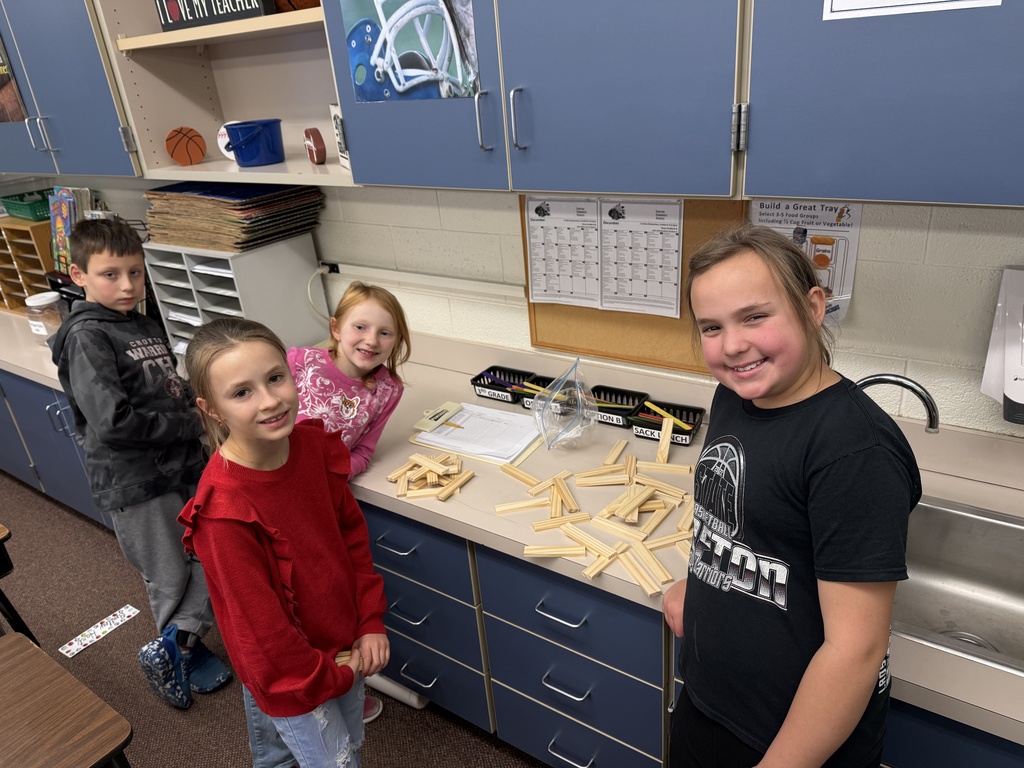 Third grade builds snowflakes with KEVA planks.