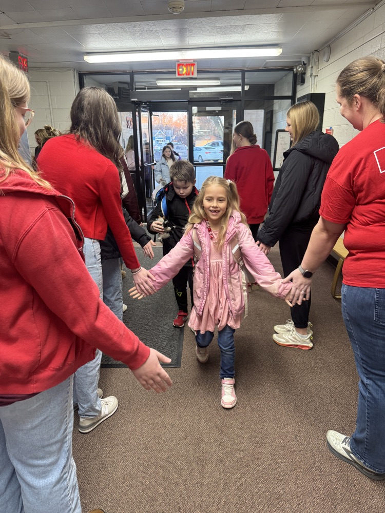FCCLA members giving high fives to elementary students