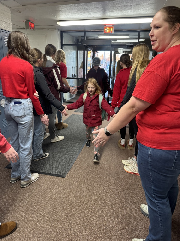 FCCLA members giving high fives to elementary students