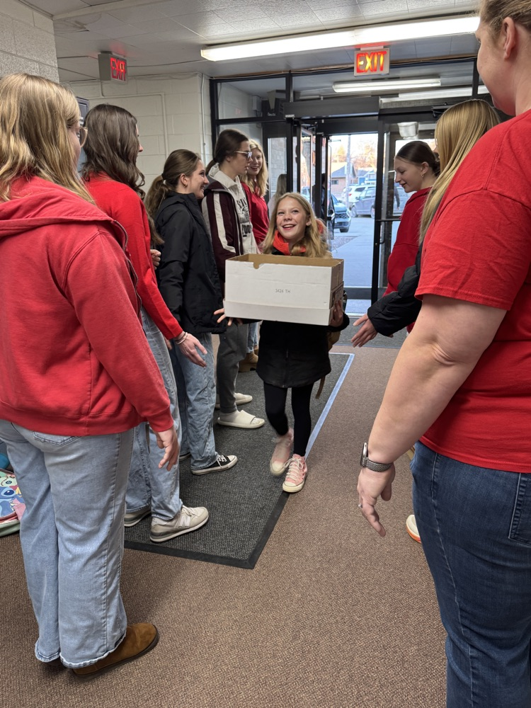 FCCLA members giving high fives to elementary students