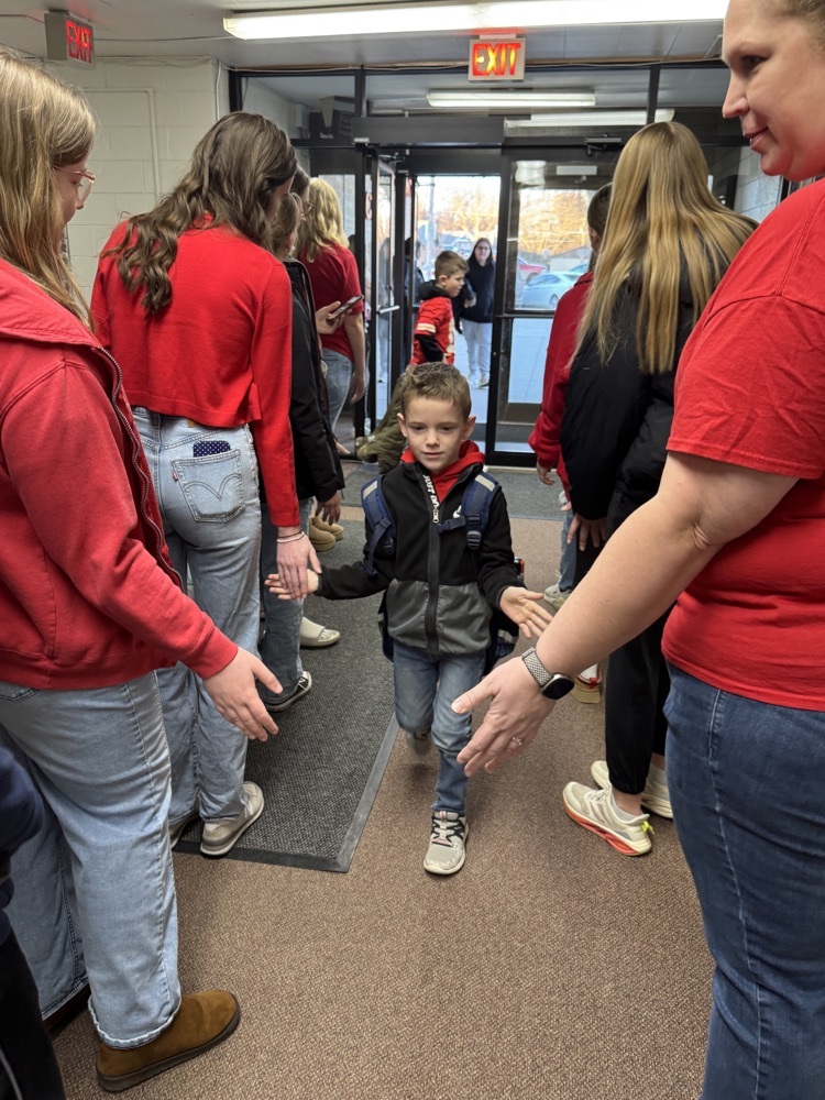 FCCLA members giving high fives to elementary students