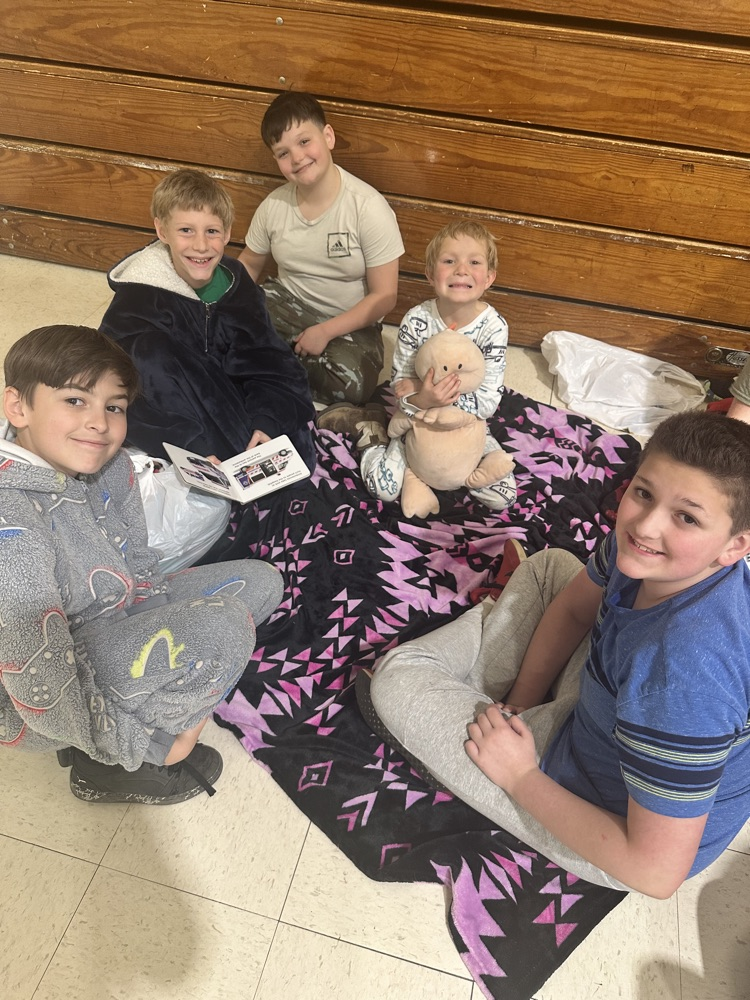 Buddies reading in the gym