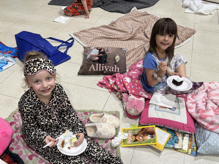 Students enjoying cake