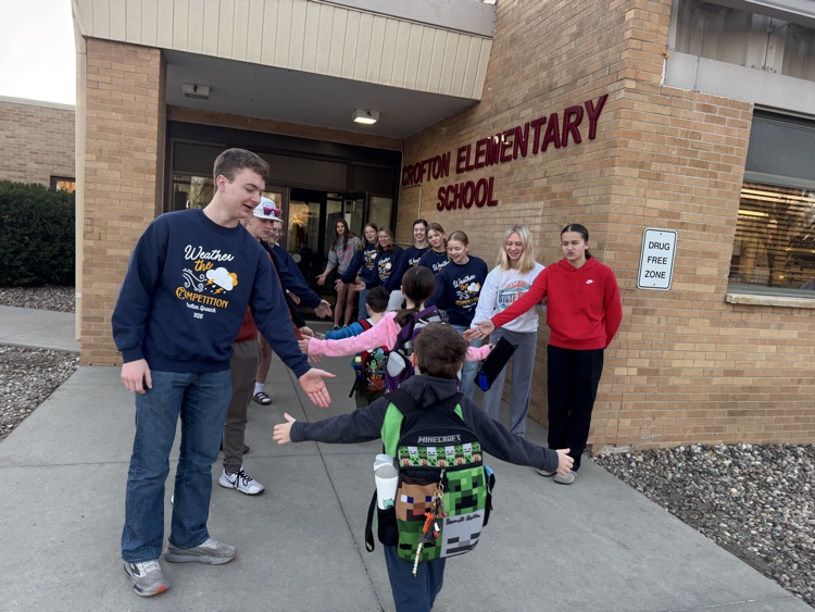 Crofton Speech Team giving High Fives 