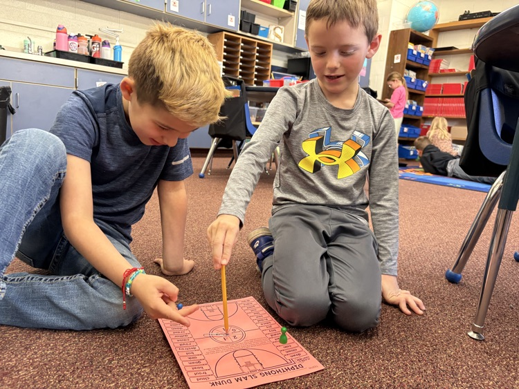 first graders playing a reading game