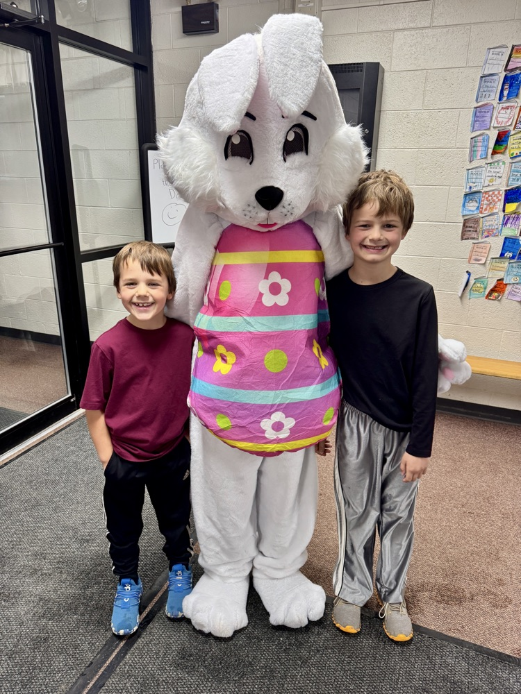 The Arens kids taking a picture with the Easter Bunny