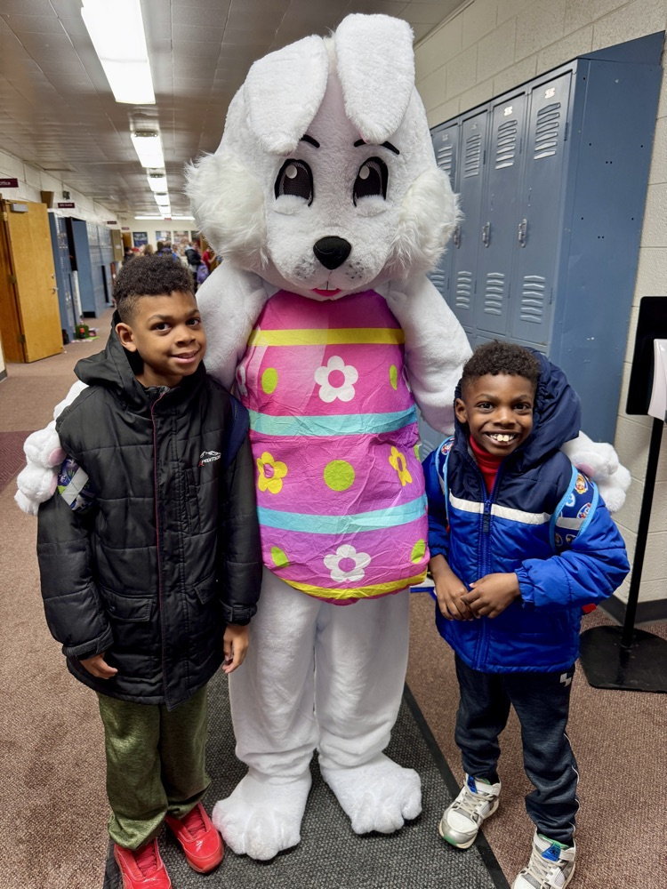Siblings taking a picture with the Easter Bunny