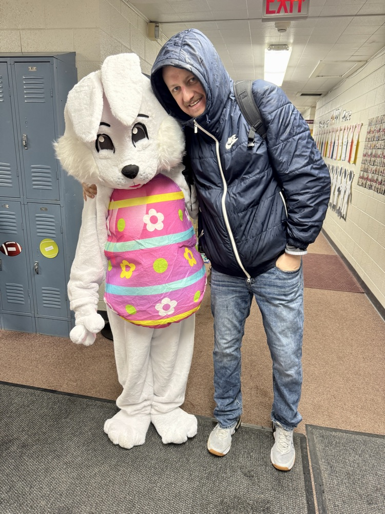 Mr. Hegge taking a picture with the Easter Bunny