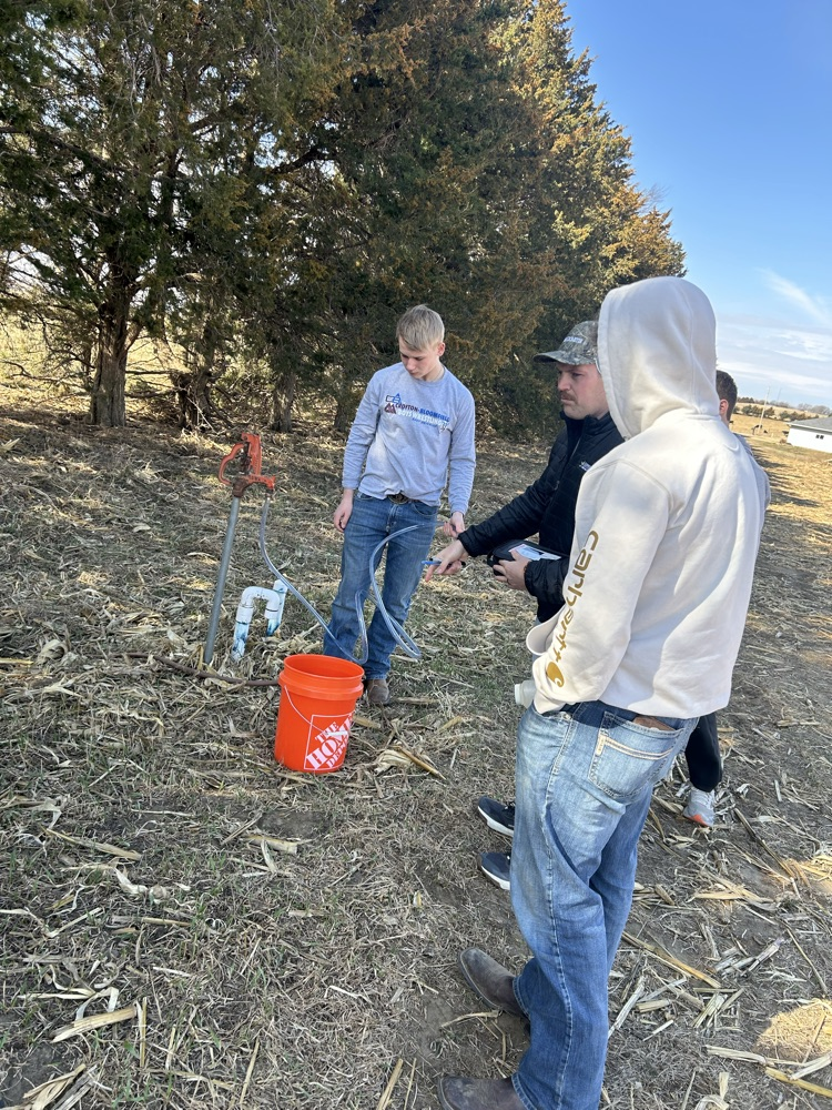 Students at well site