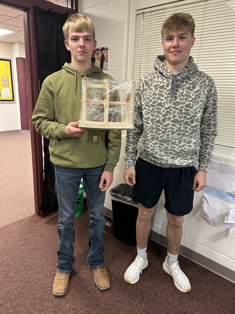 Students with completed model.