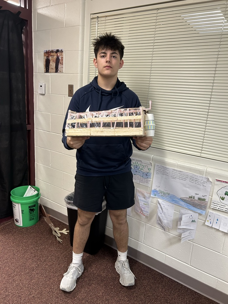 Student with completed model.