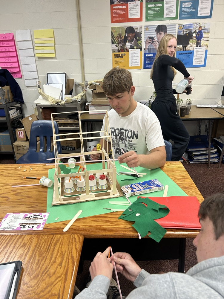 Students building models.