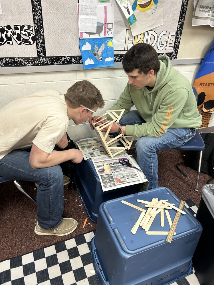 Students building models.