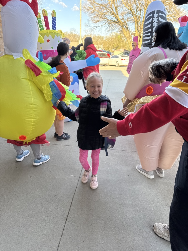Wiebelhaus Recreation staff in blow-up costumes  giving high fives