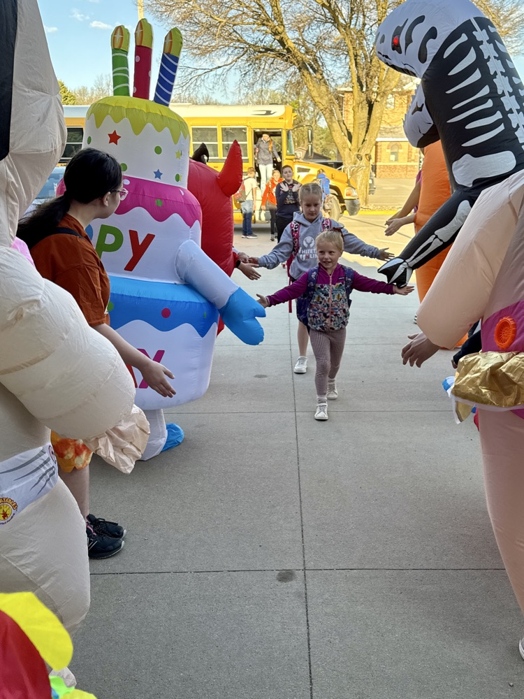Wiebelhaus Recreation staff in blow-up costumes  giving high fives 