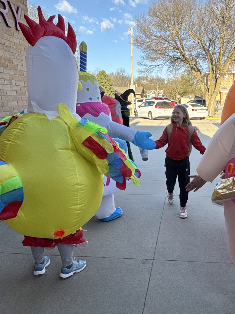 Wiebelhaus Recreation staff in blow-up costumes giving high fives 