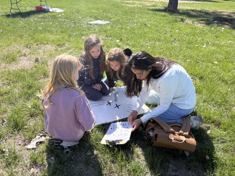 first graders examining animal tracks