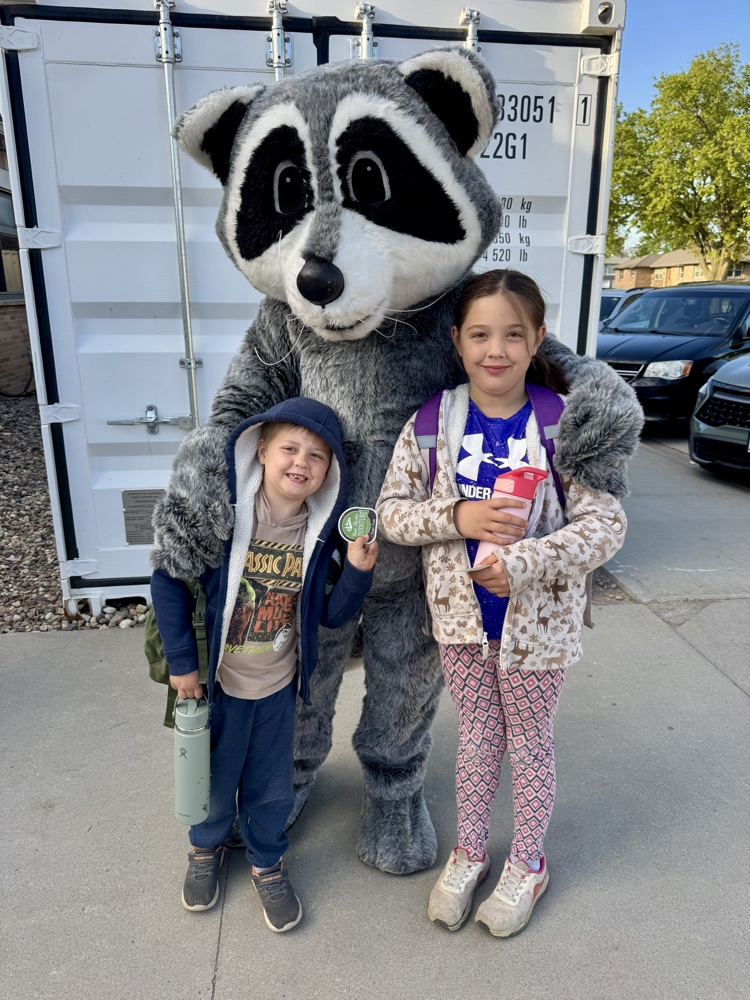 Posing with Lewis & Clark Recreation’s raccoon mascot 