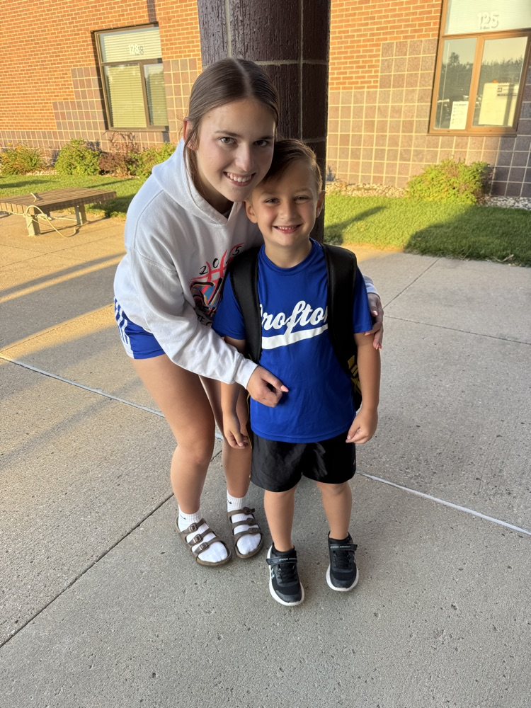 Crofton Volleyball Player posing with her little brother at High Five Friday 