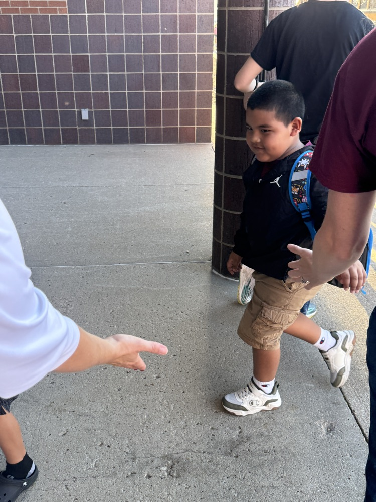 Crofton Volleyball Team handing out high fives and smiles to students