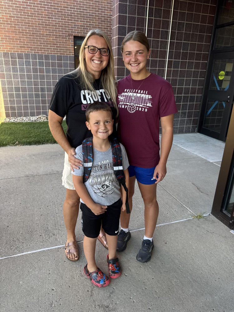 Coach and Volleyball Player poses with their son/sibling at High Five Friday