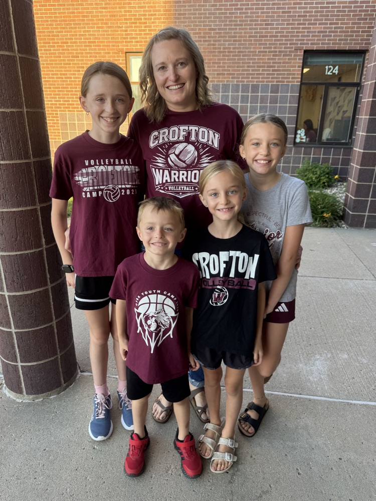 Coach poses with her children at High Five Friday 
