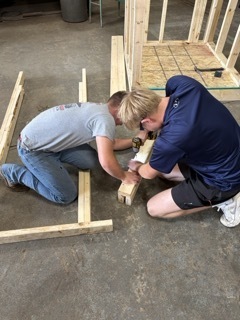 Construction Trade students assembling their door header 