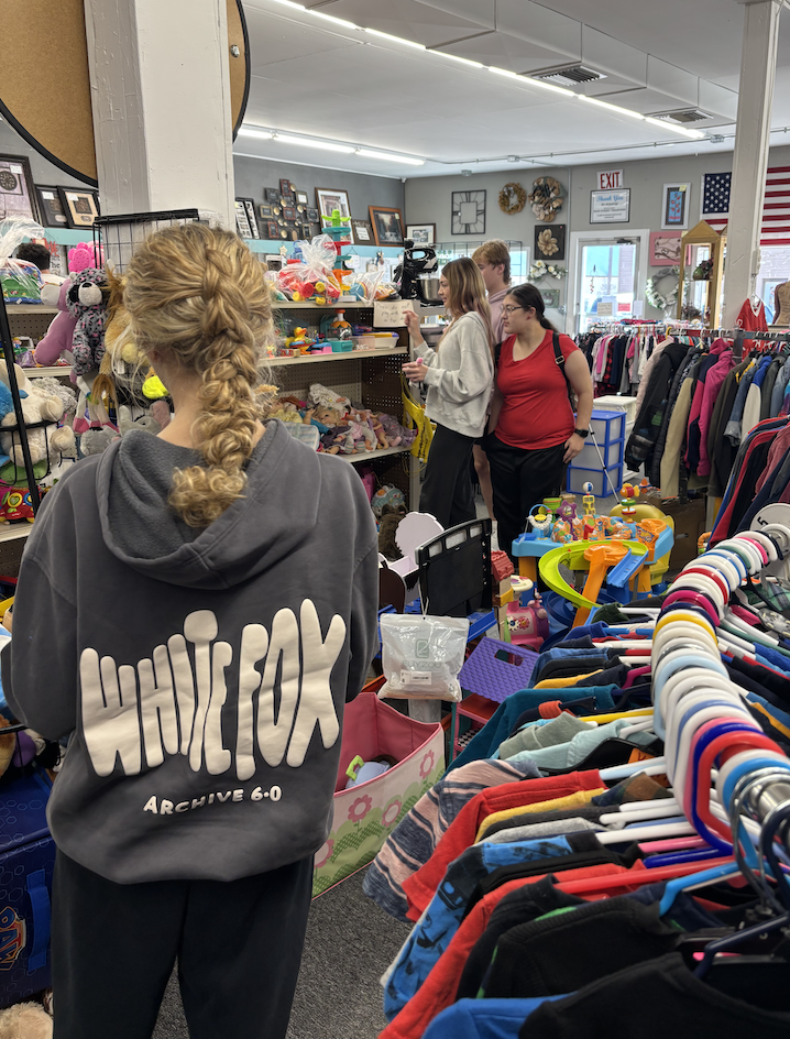 Brielle, Bella, Dominik, and Frances looking around in the thriftstore.