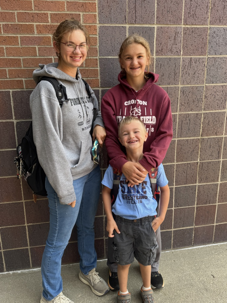 Arens siblings smiling at Cross Country for High Five Friday