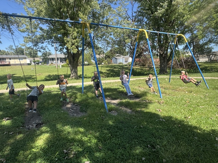 The work is done so now the kindergarteners are enjoying recess at the park on the swings!