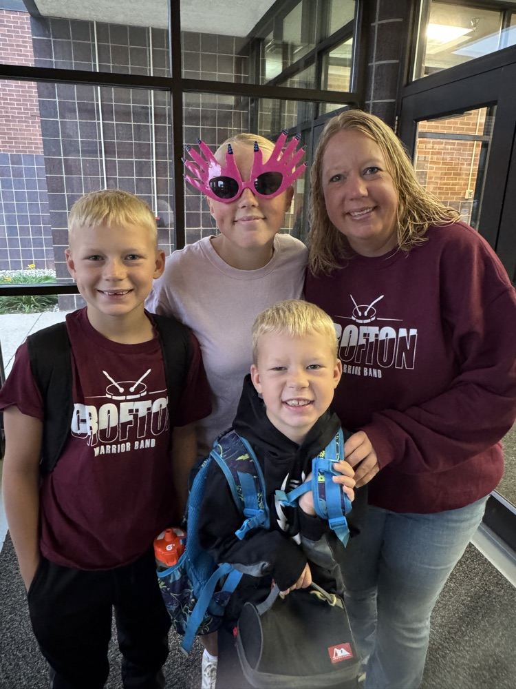 Steffen family posing together for a photo during High Five Friday